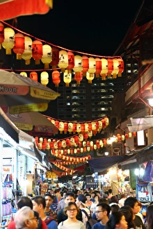 Lanterns above a street market in Chinatown for Autumn Festival in Singapore, Republic of Singapore Lanterns above a street market in Chinatown for Autumn Festival in Singapore, Republic of Singapore
