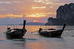 long tailed boats sunset west railay beach