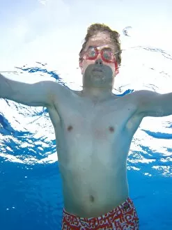 Images Dated 9th April 2011: Man swimming underwater wearing goggles