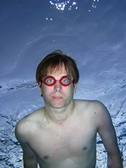 People Collection: Man swimming underwater wearing goggles