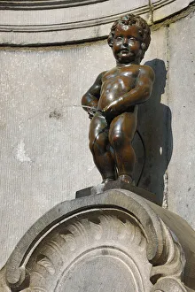 Manneken Pis, statue of a boy peeing into a fountain, Brussels, Belgium Manneken Pis, statue of a boy peeing into a fountain, Brussels, Belgium