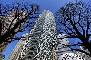 Images Dated 4th April 2013: Mode Gakuen Cocoon Tower building and silhouettes of trees in Tokyo, Japan