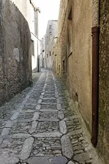Sicily Collection: Narrow alley and stone walled street in Erice, Sicily, Italy