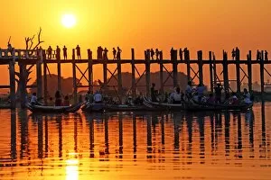 Images Dated 4th February 2016: People crossing the U Bein Bridge across the Taungthaman Lake at sunset in Amarapura