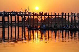 Images Dated 4th February 2016: People crossing the U Bein Bridge across the Taungthaman Lake at sunset in Amarapura