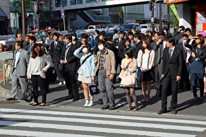 People waiting at a pedestrain crossing to cross a road in Shinjuku, Tokyo, Japan People waiting at a pedestrain crossing to cross a road in Shinjuku, Tokyo, Japan