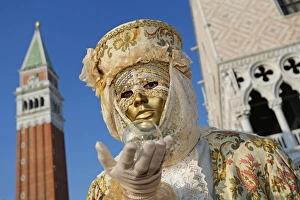 People wearing masks and costumes at the Venice Carnival