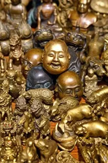 Images Dated 9th April 2015: Pile of brass figures including laughing Buddha head in the Old City, Shanghai, China
