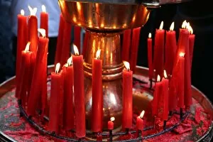 Taiwan Collection: Red candles burning at the Longshan Buddhist Temple at Chinese New Year in Taipei, Taiwan