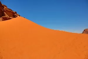 Amman and Jordan Collection: Red sand dune in the desert at Wadi Rum, Jordan