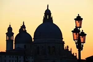 Venice Collection: Santa Maria Della Salute and a lamp post at sunset in Venice, Italy