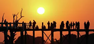 Images Dated 4th February 2016: Silhouettes on the U Bein Bridge at sunset, Amarapura, Myanmar