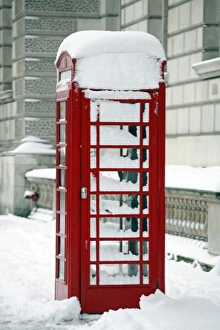 Snow on a red telephone box, London