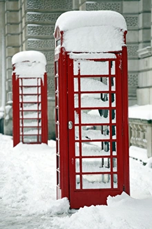 Snow on a red telephone box, London