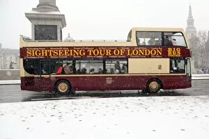Images Dated 20th January 2013: Snow and tourists on sightseeing bus in Trafalgar Square, London