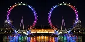 Mugs Collection: Souvenir of the Millennium Wheel / London Eye, England, illuminated in rainbow lights to celebrate
