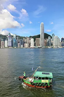 Hong Kong Collection: Traditional boat in Victoria Harbour and Skyline, Hong Kong, China