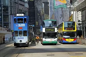 Images Dated 9th August 2012: Traditional Double-Decker Tram and buses, Hong Kong, China