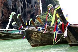 Images Dated 1st December 2012: Traditional Thai long tail boats at Phranang Cave Beach, Krabi