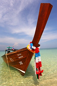 Traditional Thai long tailed boats on Ko Phi Phi Don island beach in Thailand