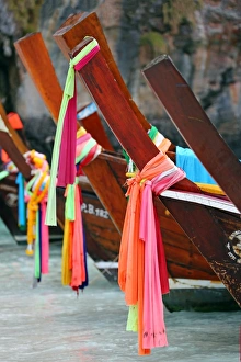 Traditional Thai long tailed boats in Maya Bay on Ko Phi Phi Le island, Thailand Traditional Thai long tailed boats in Maya Bay on Ko Phi Phi Le island, Thailand