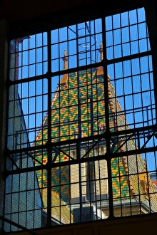 Traditional tiled roof seen through a metal framed window in Budapest, Hungary Traditional tiled roof seen through a metal framed window in Budapest, Hungary