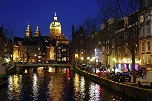 View up the canal in Oudezijds Voorburgwal at night in Amsterdam, Holland View up the canal in Oudezijds Voorburgwal at night in Amsterdam, Holland