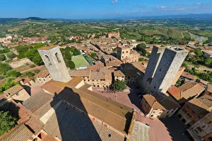 Images Dated 24th September 2019: View from the Torre Grossa over the rooftops of San Gimignano and the Tuscan countryside